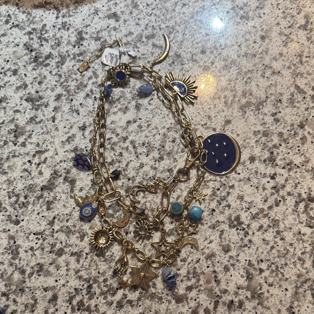 Double layered Gold-Tone Blue Charm Bracelet with Celestial Accents